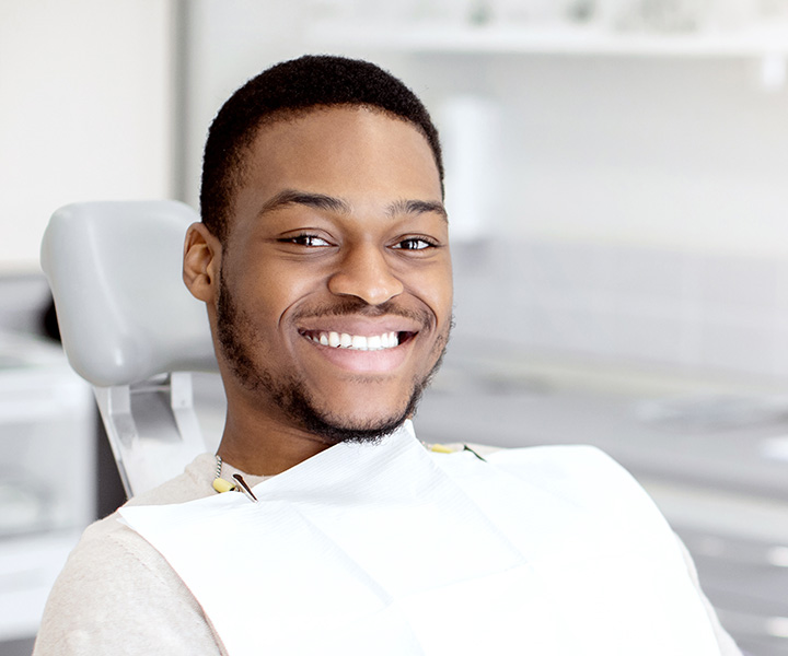 New patient sitting in dentist chair